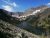 Bertha Trailhead overlook at Glacier National Park reveals a glacial lake framed by rugged, snow-dusted peaks.