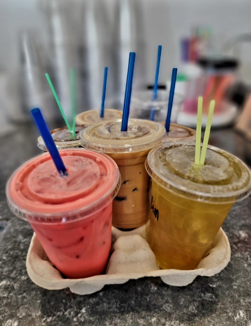 Iced drinks and colorful straws at a Glacier National Park cafe counter