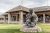 Yellowstone National Park visitor center features a bear statue sculpture in front of the building.