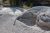 Rugged white mineral terraces and a bubbling mud pot at Artist's Paintpots Trailhead in Yellowstone National Park.
