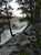 Glacial Boulder Trailhead at Yellowstone National Park offers a view of snow-covered slopes framed by pines.