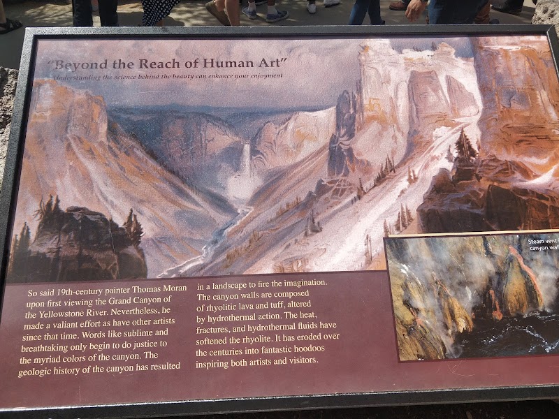 Artist Point overlook in Yellowstone National Park offers a dramatic view of the canyon's layered rhyolite cliffs high above the Yellowstone River.