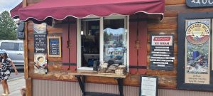Storefront exterior with a modern awning and large windows
