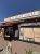 Ice cream and espresso stand at Yellowstone National Park, with a large menu board and signage visible outside the shop.