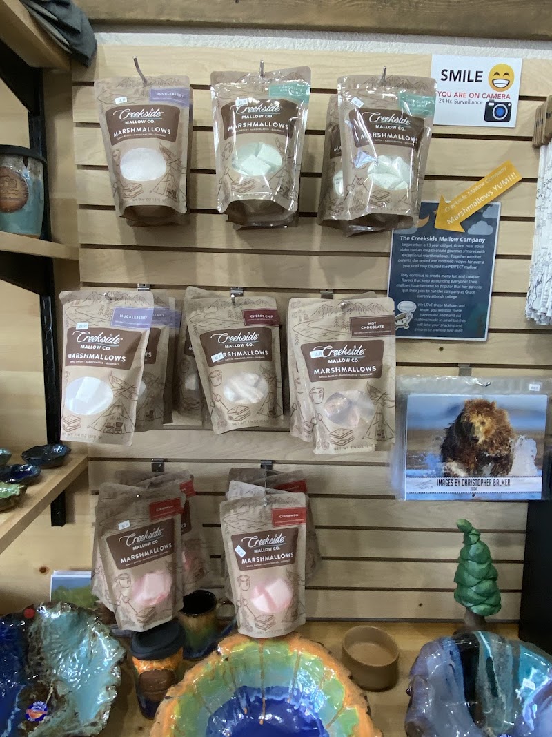 Rows of marshmallow bags on a wooden wall display at a gift shop in Yellowstone National Park.