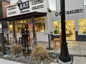 Facade of a modern restaurant with glass windows and awning