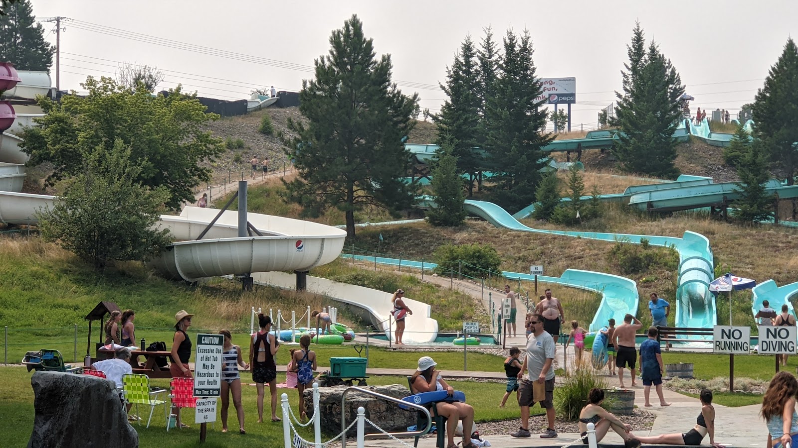 Water slides weave through a wooded hill at a waterpark near Glacier National Park, Montana.