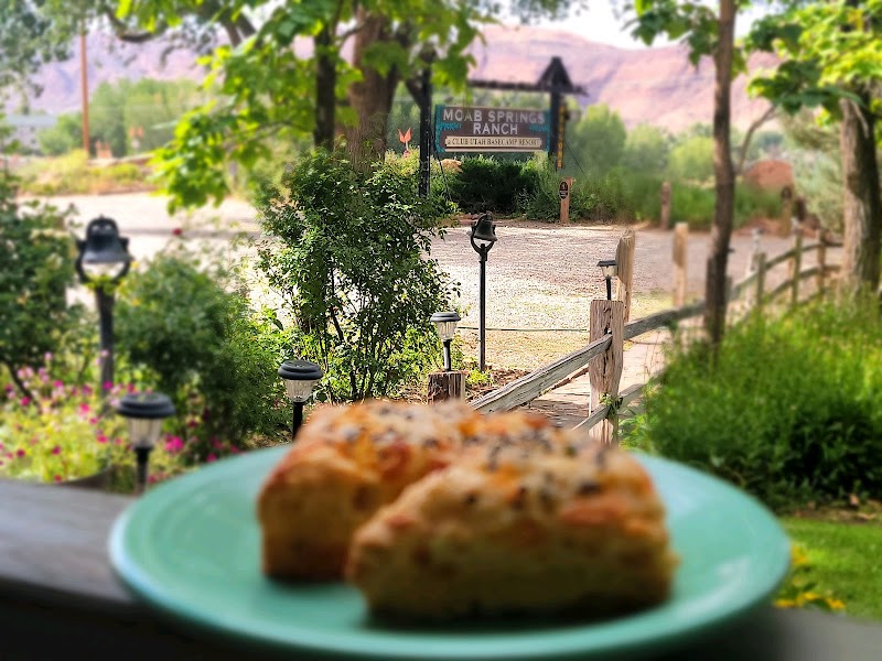 Moab Springs Ranch entrance signs with a pie in the foreground near Arches National Park, Utah.