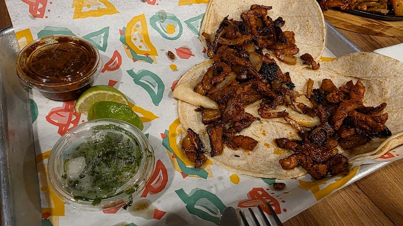 Carne asada tacos on soft tortillas with grilled onions, lime, and salsa at Acadia National Park.