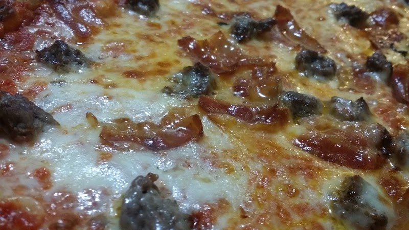 Close-up of a cheesy pepperoni pizza served in Acadia National Park dining area.