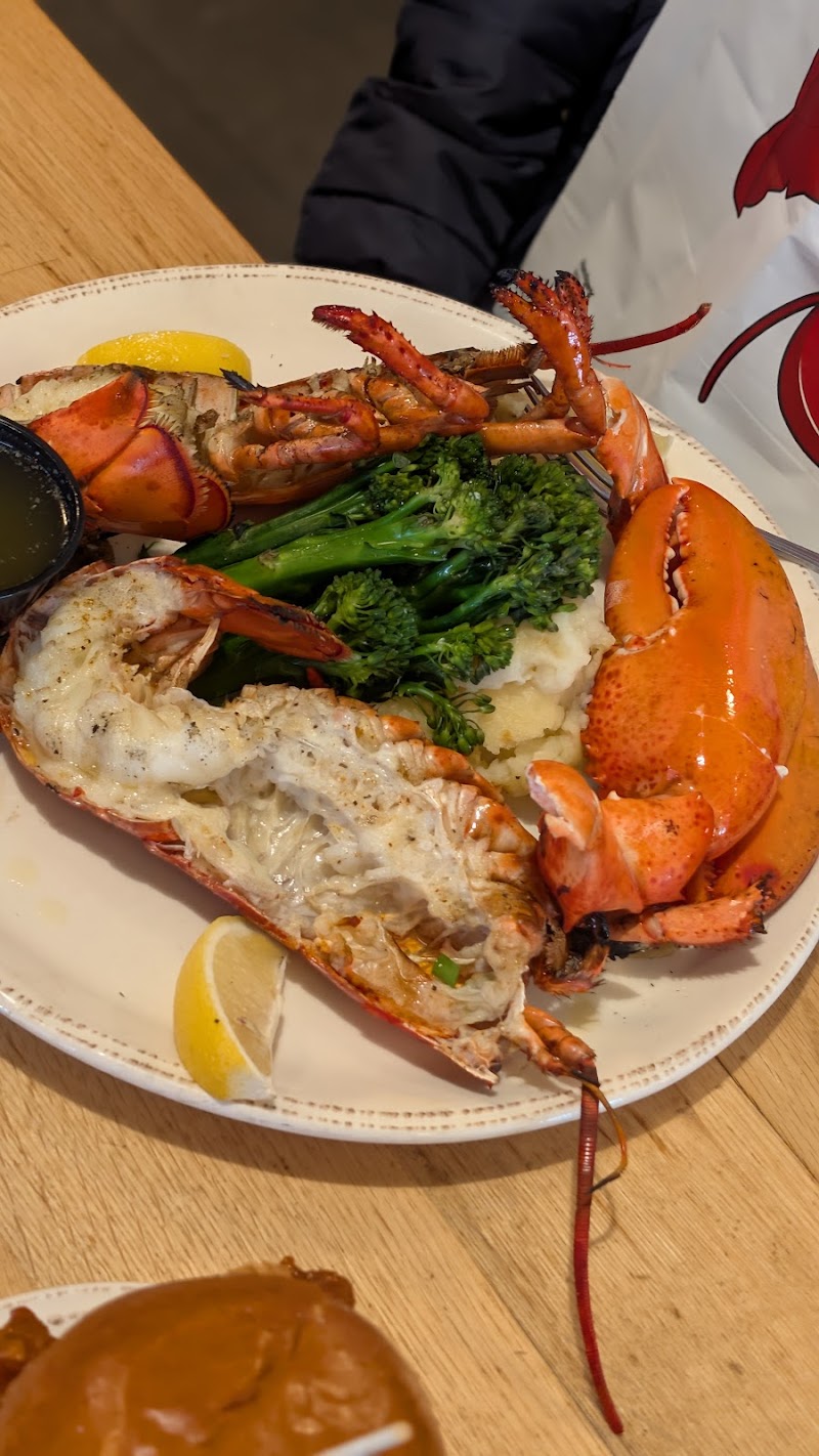 Chef sautéing a sizzling signature dish at the grill