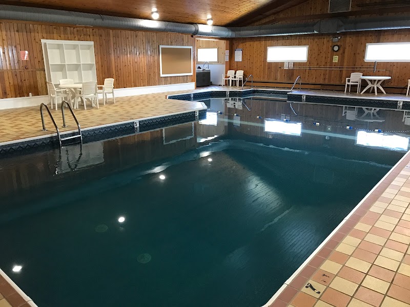 Indoor pool area inside a lodge-style building at Acadia National Park, with wooden walls and tile deck.