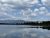 Lonesomehurst Campground sits along Yellowstone National Park's shore of Yellowstone Lake with pines and distant mountain reflections.