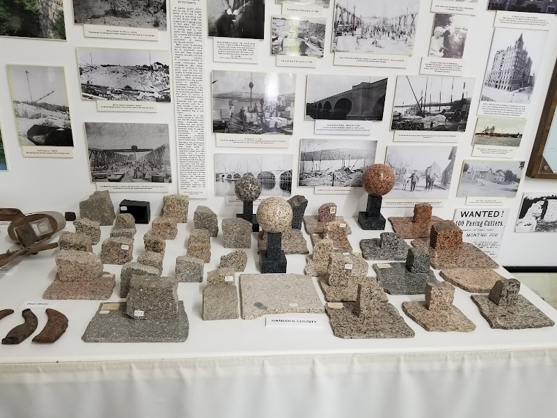 Granite stone samples and period displays inside a park museum in Acadia National Park.