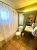 Yellowstone National Park motel bathroom with a shower curtain, toilet, and sink in a guest room.
