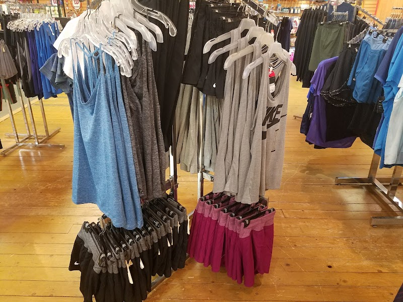 Indoor view of a gift shop near Cadillac Mountain in Acadia National Park, stocked with athletic apparel and souvenirs.