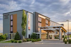 Kalispell hotel exterior, a contemporary lodging building serving Glacier National Park visitors, photographed from the parking lot.