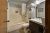 Guest bathroom in Gardiner-area lodge near Yellowstone National Park, featuring a tub/shower and vanity.
