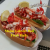 Two lobster rolls with lemon wedges on a white tray at a Bar Harbor seafood spot near Acadia National Park.