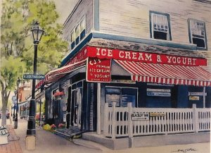 Corner storefront with red striped awning reading ICE CREAM & YOGURT, white picket fence, street lamp, in Acadia National Park.