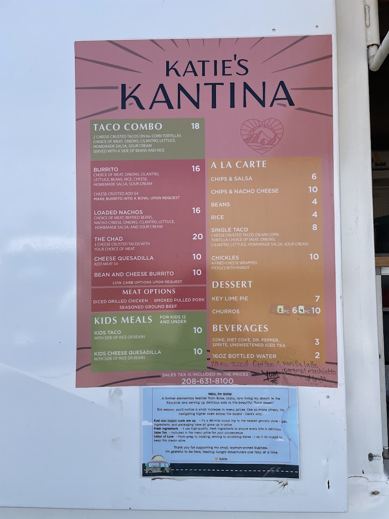 Menu board at a kiosk shows taco combos, burritos, quesadillas, sides and desserts for Badlands National Park.