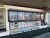 Ice cream shop storefront in Yellowstone National Park, featuring a colorful menu board and dessert options.