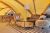 Luxurious glamping tent living area with sofa, armchair, rug and floor lamp inside a Yellowstone lodging tent.