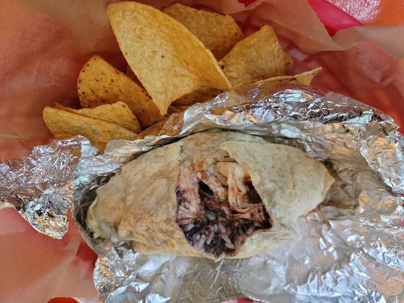 Burrito wrapped in foil with tortilla chips served at El El Frijoles Mexican Food in Acadia National Park.