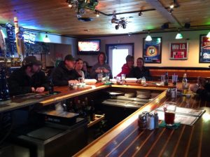Indoor view of a pizza restaurant bar area near Acadia National Park in Ellsworth, Maine.