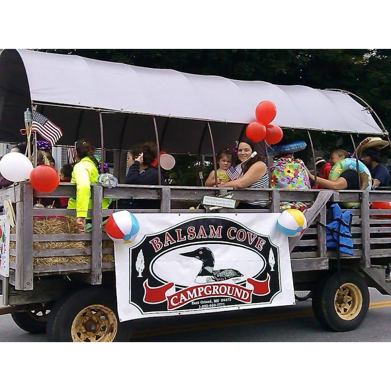 Balsam Cove Campground float with balloons and campers on a parade trailer in Acadia National Park.