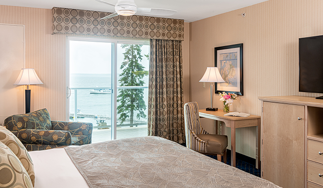 Hotel room at Acadia National Park featuring an ocean-view balcony and daylight from the coast.