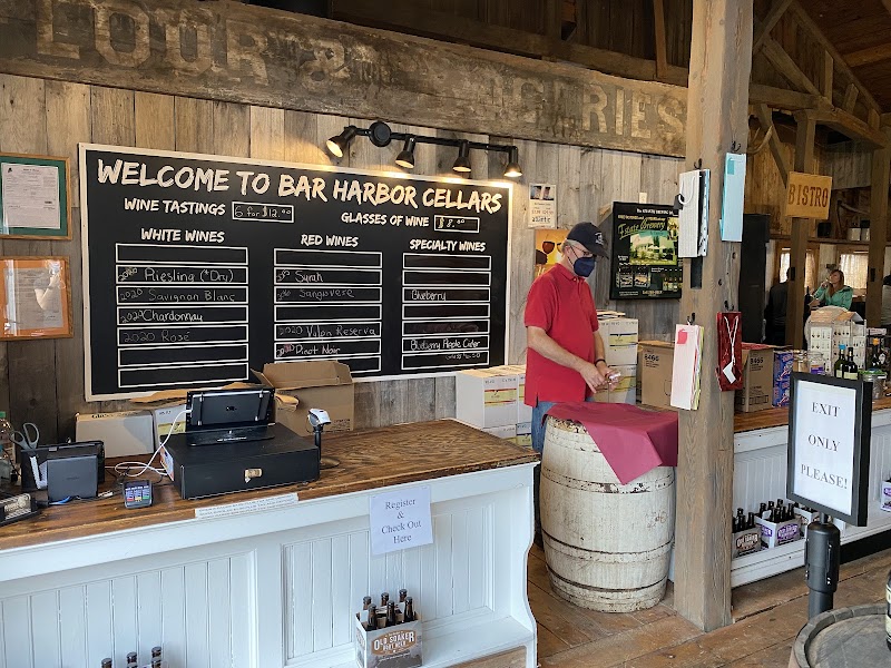Rustic gift shop wine tasting area at Acadia National Park in the Bar Harbor area, with a chalkboard menu and warm wood décor.