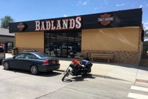 Exterior view of a gift shop storefront with motorcycle-themed decor