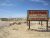 RV campground in Big Bend National Park with desert terrain and a line of campers in the distance.