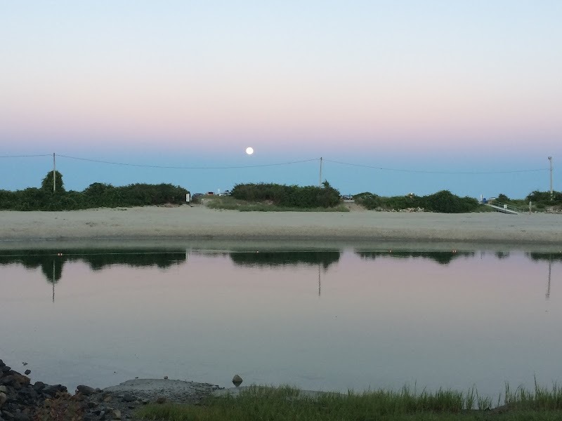 Trenton Beach at moonrise, pastel sky over calm water in Acadia National Park, near Trenton.