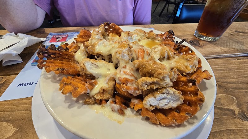 Plate of fried chicken and cheddar cheese waffles served at a park-side restaurant in Acadia National Park.
