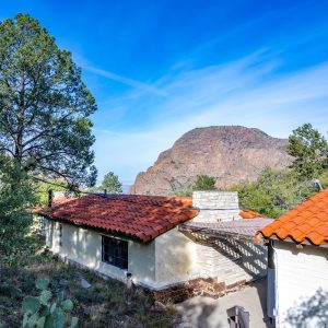 Lodge complex at Chisos Mountains area in Big Bend National Park with red-tiled roofs and rocky backdrop.