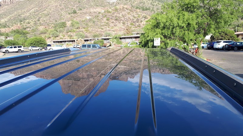 Reflection of blue sky on a glossy roof near the lodge parking area in Big Bend National Park.