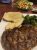 Yellowstone National Park dining venue plate featuring a seared steak with potatoes and broccoli on a white plate.