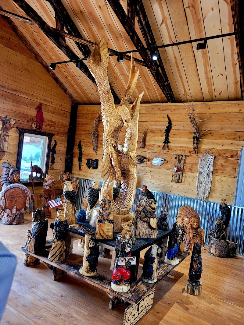 Customer admiring a chainsaw sculpture centerpiece