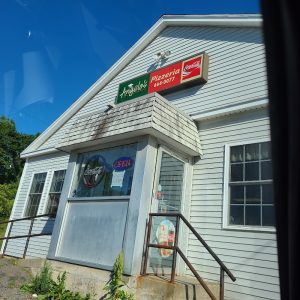 Pizzeria storefront with Coca-Cola sign in Acadia National Park, a small roadside eatery.