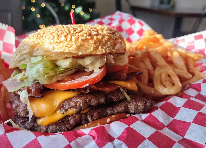 Sesame bun cheeseburger with lettuce and tomato at a cafe in Acadia National Park.