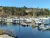 Southwest Harbor dock at Acadia National Park features moored boats and calm water on Mt. Desert Island.