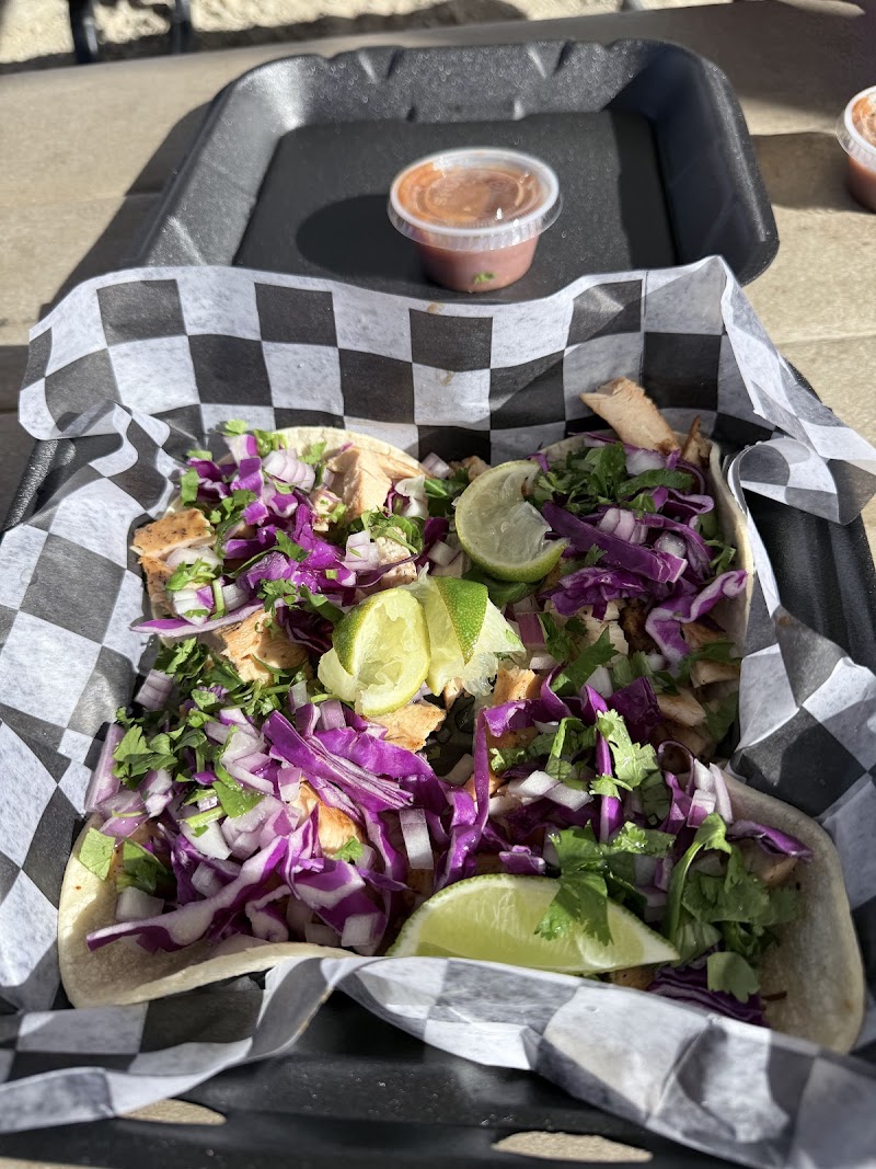 Taco platter with lime wedges, purple cabbage, onions, and cilantro at a Big Bend National Park restaurant.