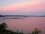 Harborside at Acadia National Park showcases a pink sunset over tranquil harbor waters.