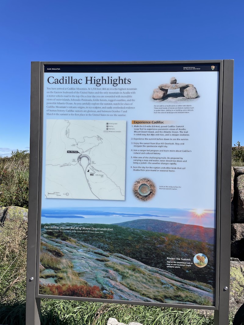 Cadillac Mountain signage panel at Acadia National Park detailing Cadillac Highlights and local trails.