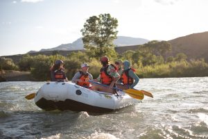 Group of rafters navigating the Yellowstone River in Yellowstone National Park on a guided trip.