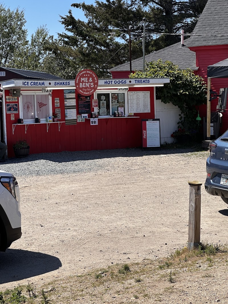 Red dairy cream stand in Acadia National Park offering ice cream, shakes, and snacks near a small building.