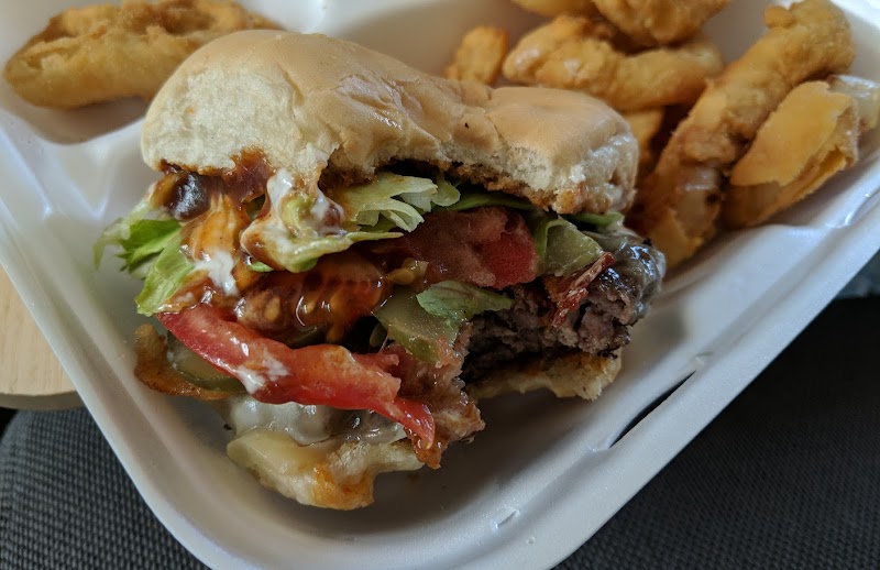Hamburger with lettuce, tomato, onions, and melted cheese at Acadia National Park eatery.