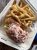 Lobster roll with crinkle-cut fries at Crosby's Drive-In near Acadia National Park, a seaside grill.